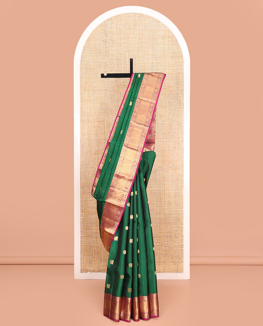Green Vasundhara Lite Silk Mix Saree, Richly Detailed with Mayil and Chakram Buttas All Over Its Body, Complemented by Contrast Border of Rudraksham, Chakram, Yaanai, Mayil, Vanki, and Ara Maadam Designs, Grand Jaal Pallu and Paired with a Contrast Blouse