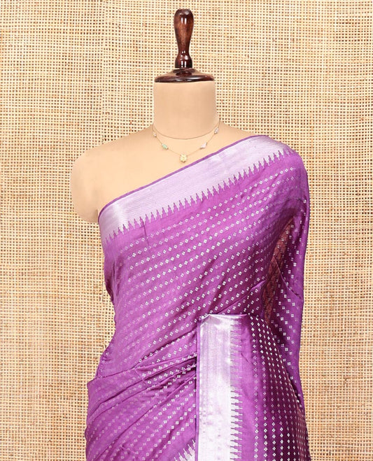 Purple Banana Pith Saree, Elevated with Buttas All Over Its Body, Highlighted by Temple Zari Border, Pallu of Gleaming Zari Stripes, and Paired with a Matching Blouse