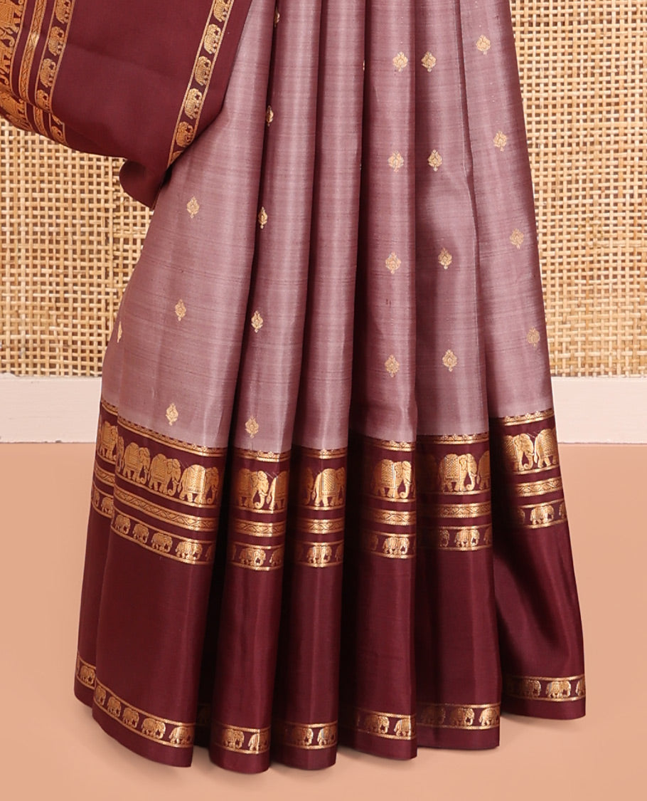 Grey Vasundhara Silk Saree, Adorned with Zari Buttas All Over Its Body, Complemented by a Contrast Rettai Pettu Border of Yaanai Designs, Grand Jaal Pallu, and Paired with a Contrast Blouse