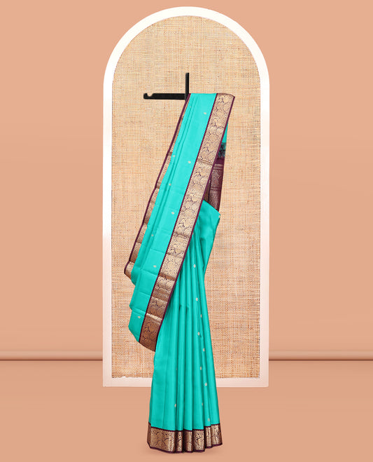 Blue Vasundhara Silk Saree, Adorned with Zari Buttas, a Contrast Korvai Border of Thilakam, Banaras, and Mayil Designs, Richly Woven Pallu, and a Contrast Blouse