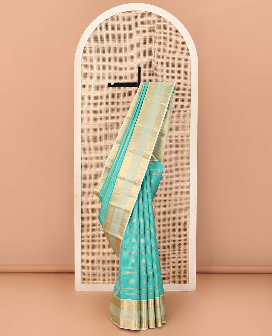 Turquoise blue zari design silk saree, contrast traditional motifs steeped zari border, and zari-rich jaal pallu