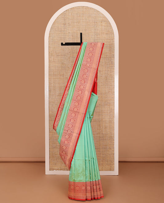 Green zari buttas katan silk saree, contrast traditional border of floral creeper design, and floral jaal pallu