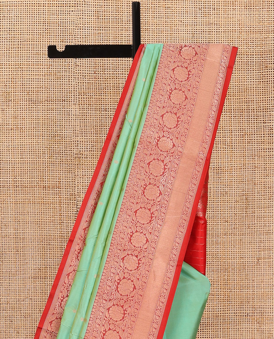 Green zari buttas katan silk saree, contrast traditional border of floral creeper design, and floral jaal pallu