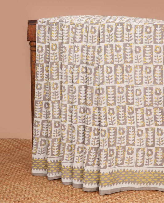 Mustard floral motifs block design mul mul cotton saree with contrast striped border & geometric design pallu