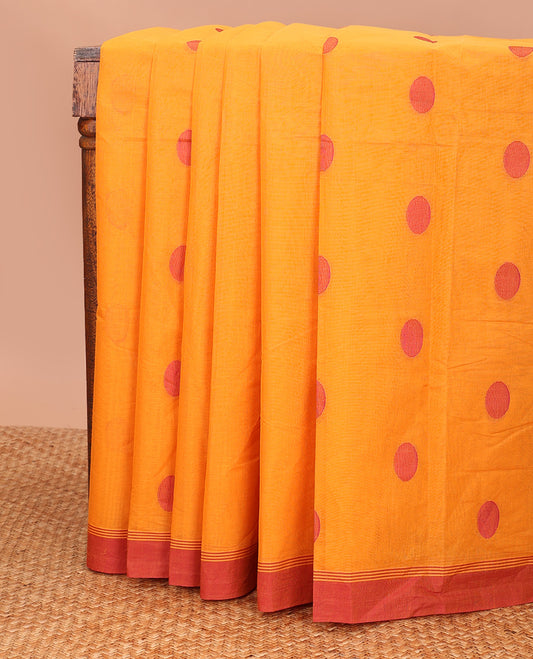 Orange polka dots buttas kanchi cotton saree, contrast  border, and pallu of jaal designs