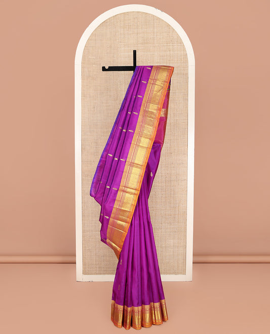 Rani Pink Kanchipuram Silk Saree, Embellished with Zari Buttas on Its Body, Complemented by a Contrast One-Sided Border of Paneer Sombu, Banaras, Muthu and Jaal Designs, Pallu of Zari Designs, and Comes Without a Blouse