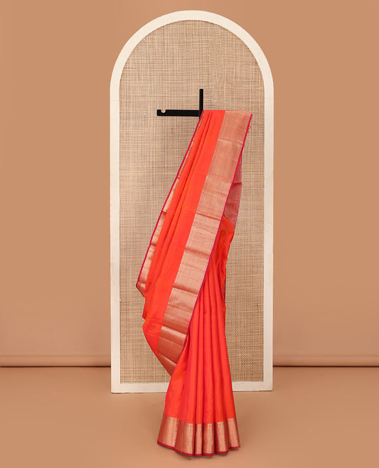 Orange plain Kanchipuram silk saree, contrast border of thilakam, banaras, kuyil kann, and rudraksham designs, and jaal pallu