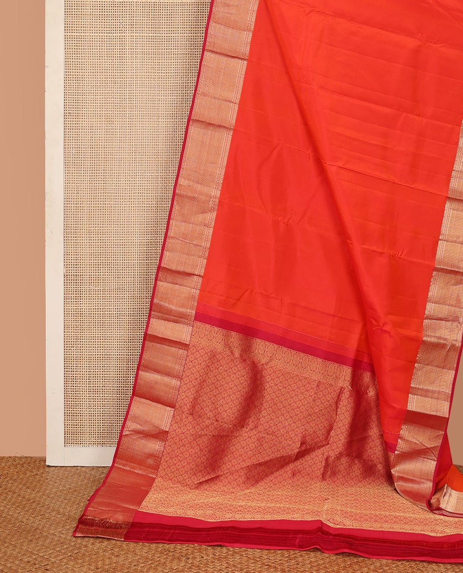 Orange plain Kanchipuram silk saree, contrast border of thilakam, banaras, kuyil kann, and rudraksham designs, and jaal pallu