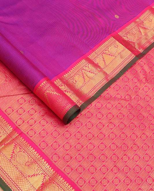Purple Kanchipuram Silk Saree, Beautified with Kamalam Zari Buttas on Its Body, Complemented by Contrast Border of Rekku, Muthu, Mayil Kann, Mayil, and Vanki Designs, Pallu of Butta Enclosed Checks, and Paired with a Contrast Blouse