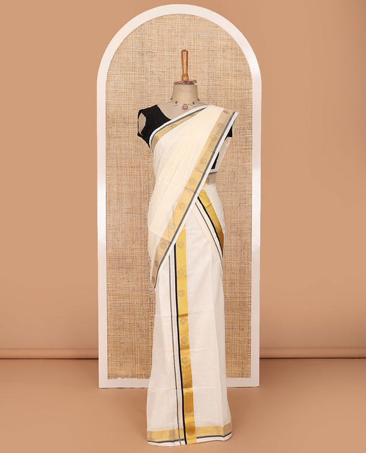 Cream plain Kerala mundu set with contrast zari border decked up with micro-stone chakram motifs