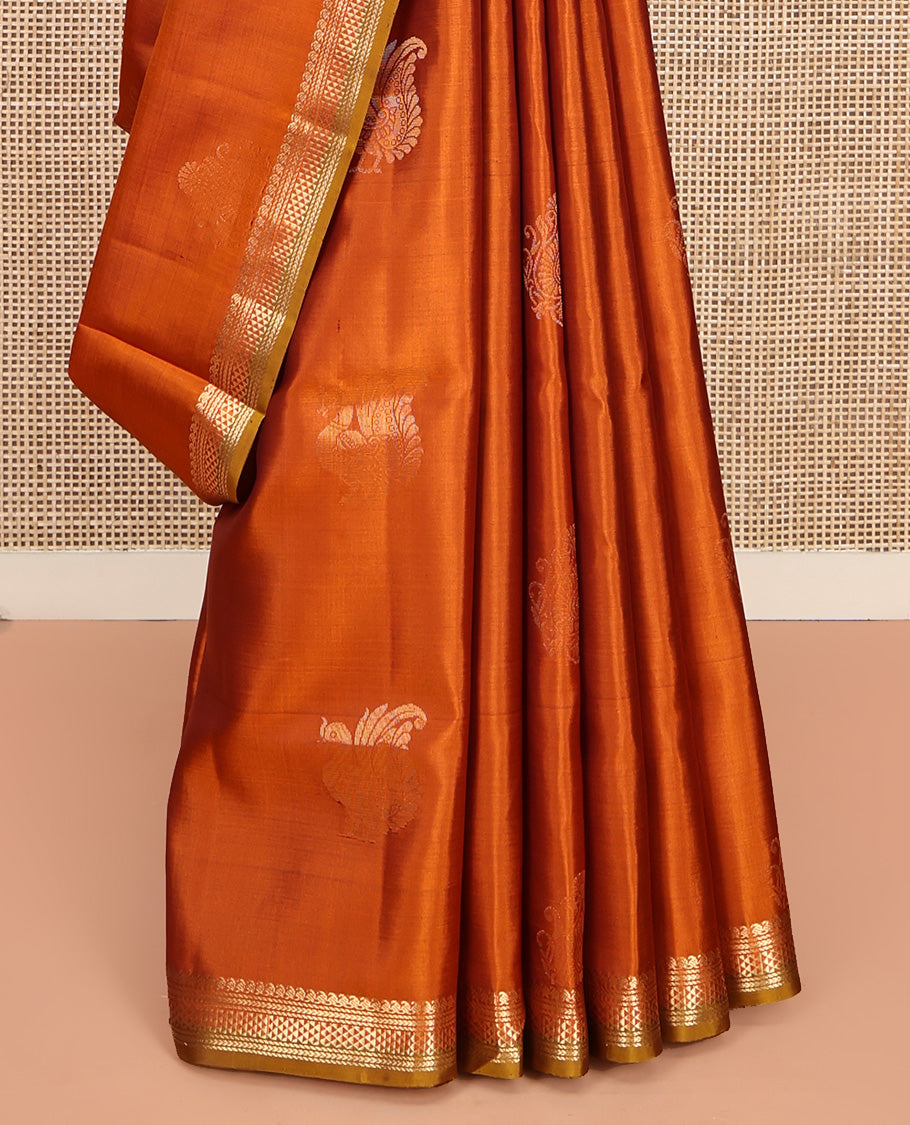 Orange Mayuri Soft Silk Saree, Accentuated with Zari Buttas All Over Its Body, Highlighted by Zari Border of Manga Mokku, and Ara Maadam Designs, and Paired with a Contrast Geometric Patterned Pallu and Paired with a Contrast Blouse