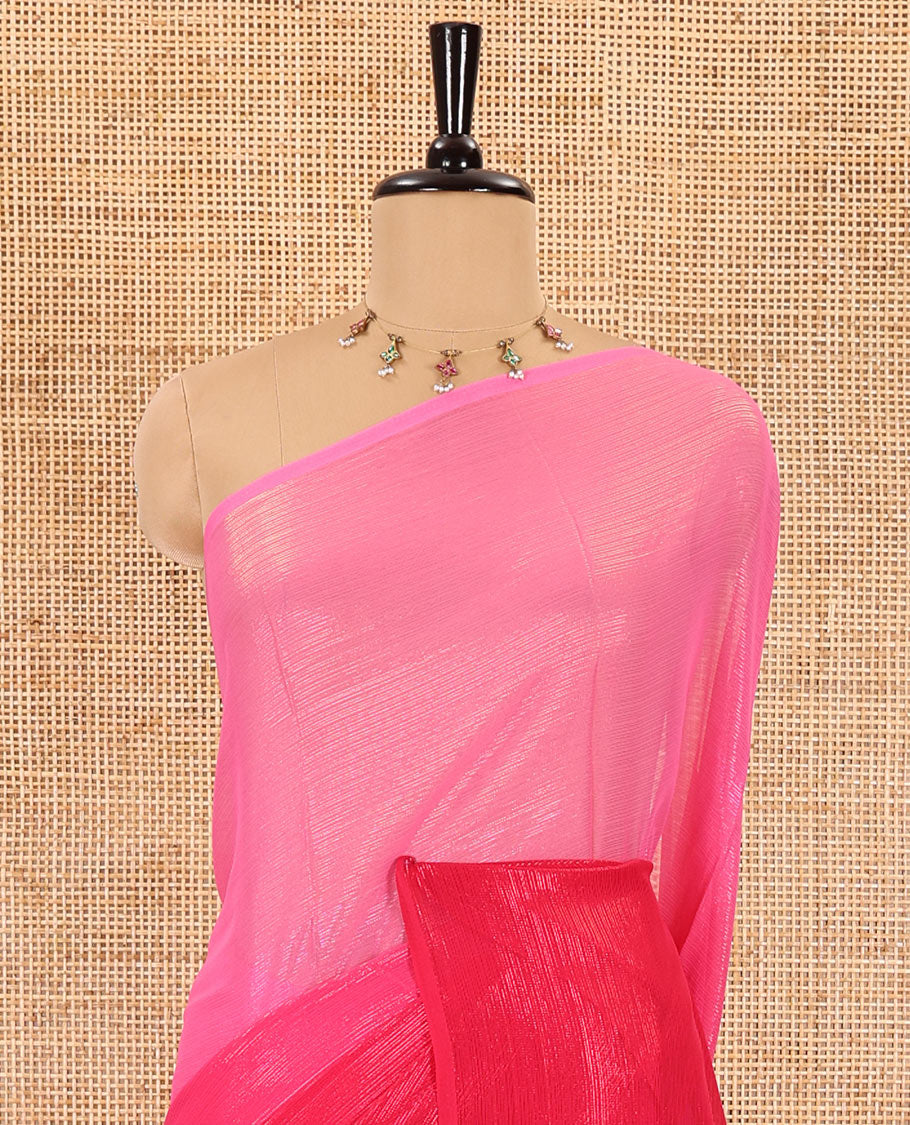 Borderless pink ombre-toned gleaming Shimmer Georgette saree, self-pallu with tassels and a plain pink blouse
