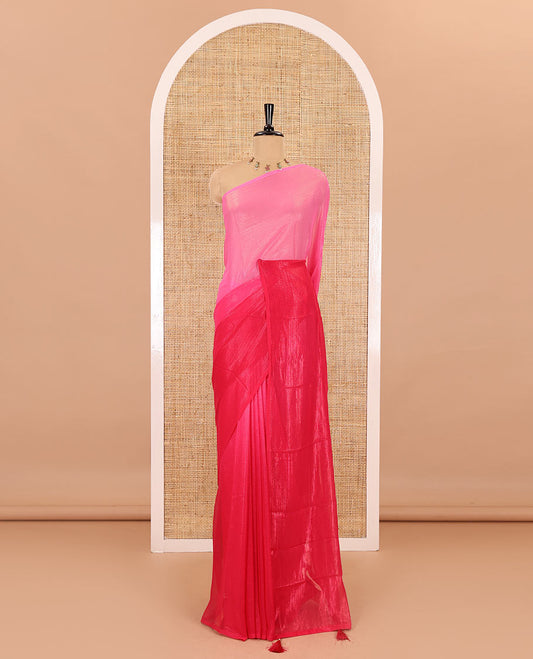 Borderless pink ombre-toned gleaming Shimmer Georgette saree, self-pallu with tassels and a plain pink blouse