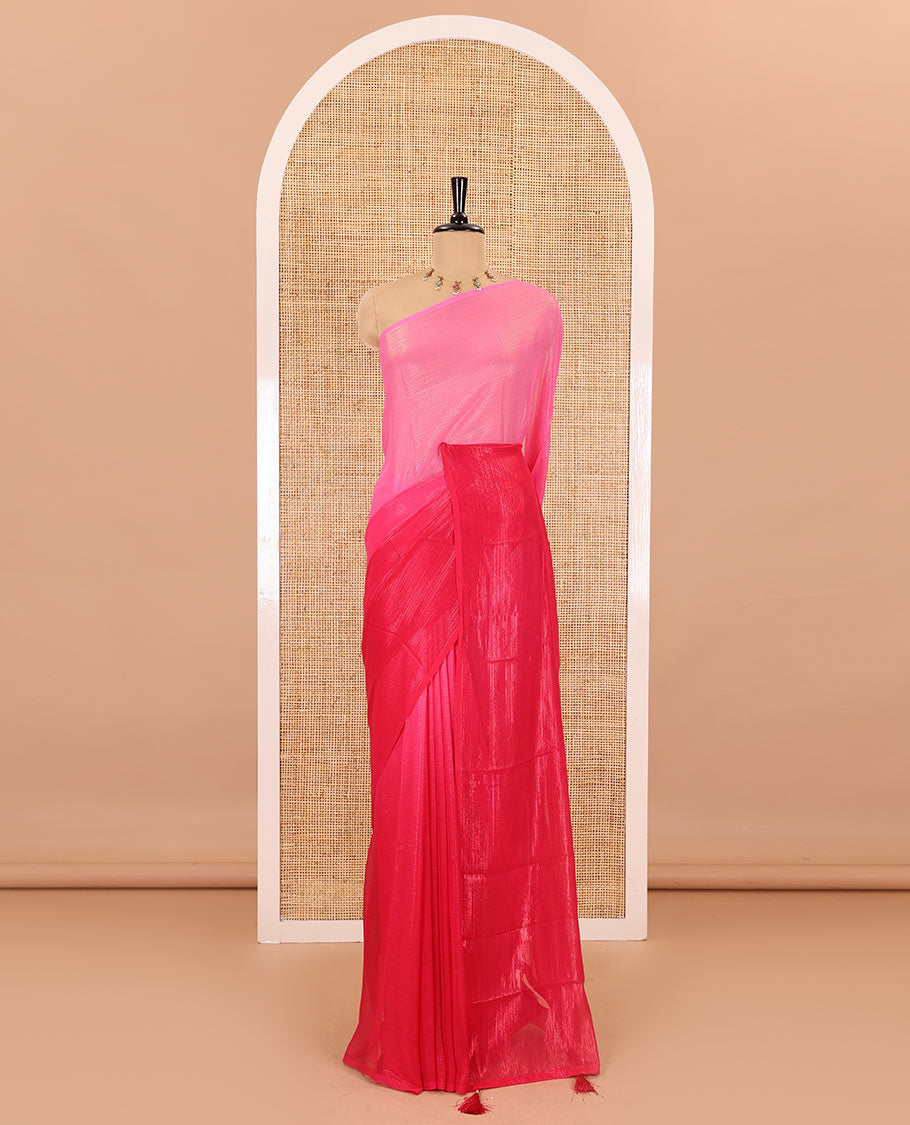 Borderless pink ombre-toned gleaming Shimmer Georgette saree, self-pallu with tassels and a plain pink blouse