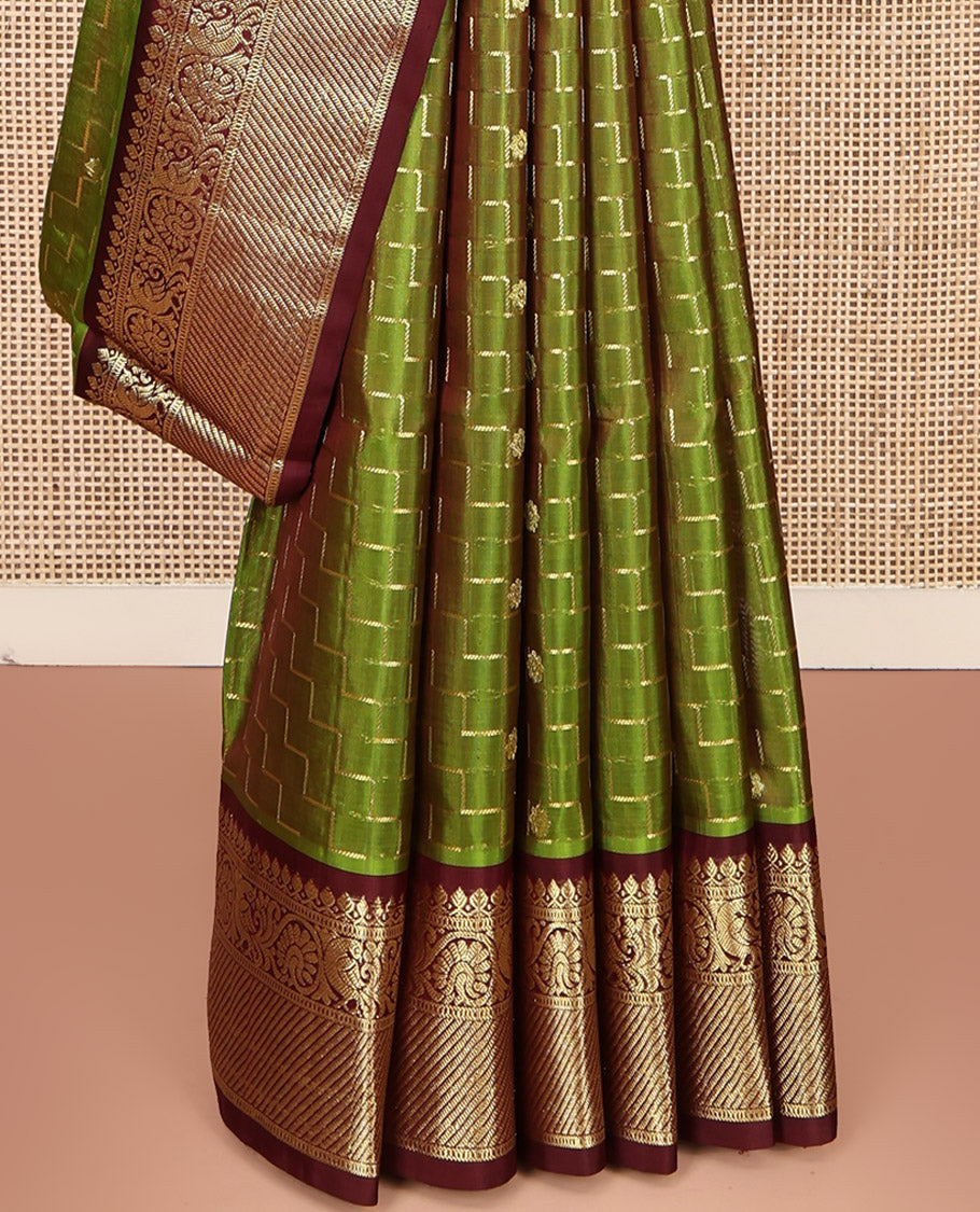 Green Venkatagiri Silk Saree, Delicately Woven with Zari Butta and Chevron Stripes All Over Its Body, Complemented by a Contrast Traditional Zari Border, Pallu of Ogee Designs, and Paired with a Contrast Blouse
