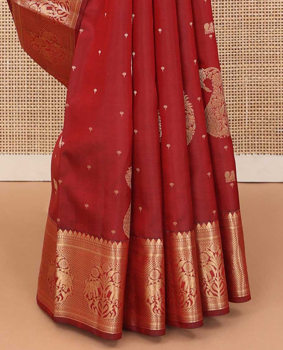 Maroon zari buttas silk saree, zari border of thilakam mokku, muthu, kathir, ara maadam, and yaanai, and jaal pallu