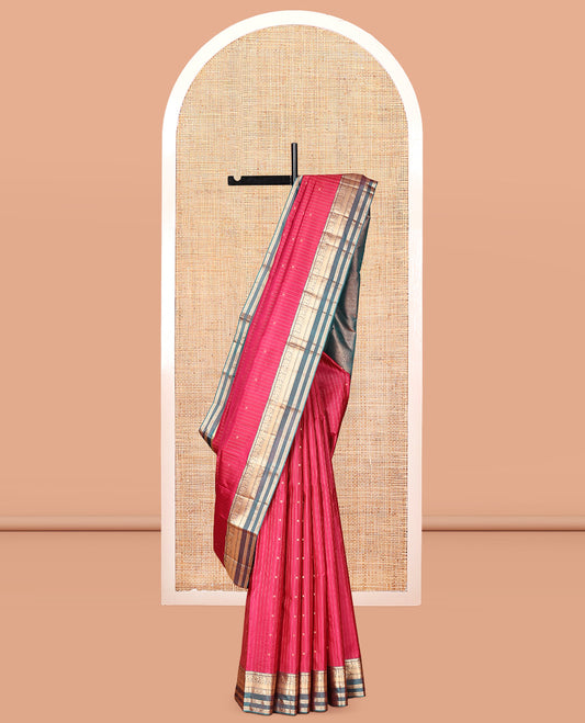 Red Vasundhara Silk Saree, Spotlighted with Zari Buttas and Stripes, a Contrast Rettai Pettu Border of Thilakam, Kamalam, Banaras, and Muthu Designs, Jaal Pallu, and Contrast Blouse