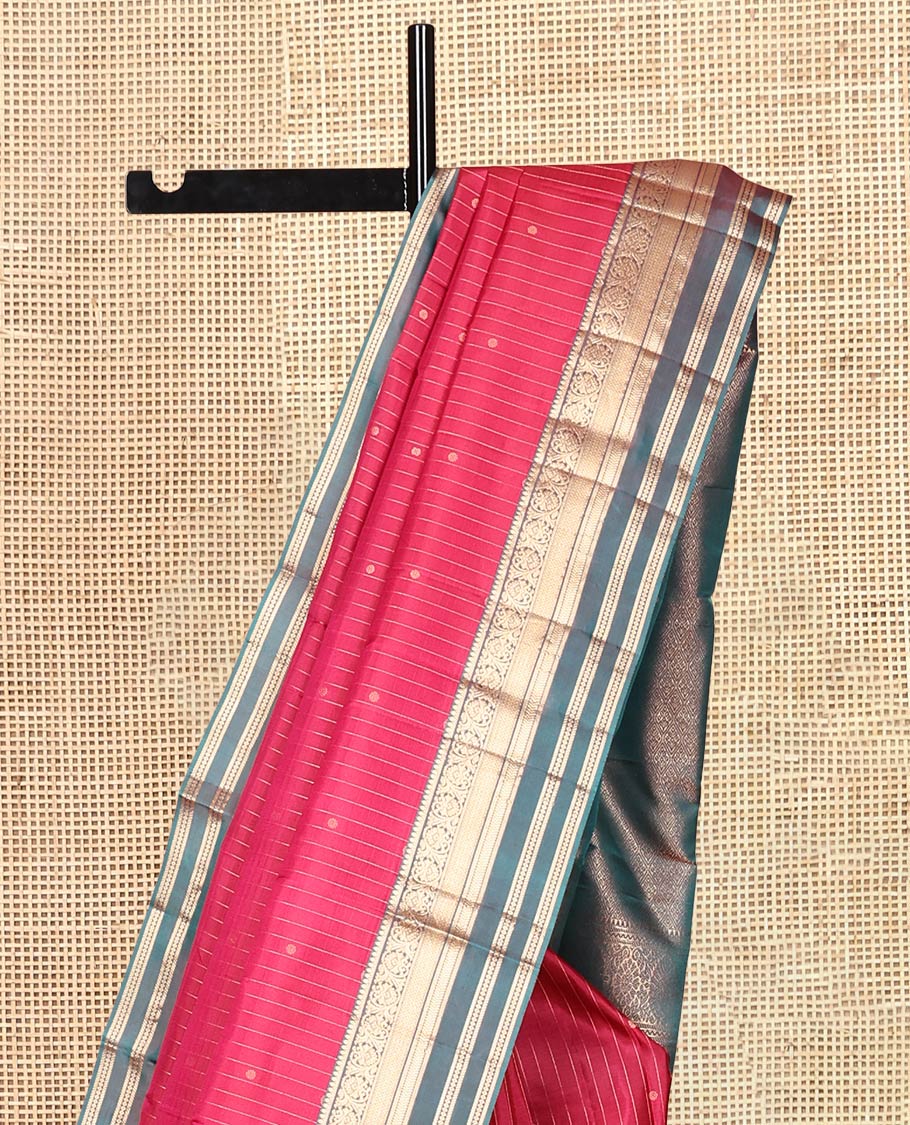 Red Vasundhara Silk Saree, Spotlighted with Zari Buttas and Stripes, a Contrast Rettai Pettu Border of Thilakam, Kamalam, Banaras, and Muthu Designs, Jaal Pallu, and Contrast Blouse