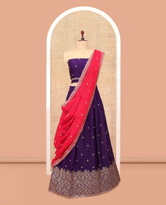 Violet Banarasi Half-Saree, Majestically Detailed with Embroidered Skirt, a Floral Embroidered Border, a Matching Blouse, and Contrast Scallop Embroidered Dupatta