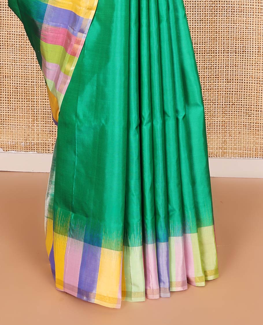 Green zari buttas soft silk saree, contrast multi-colored striped border, and jaal pallu