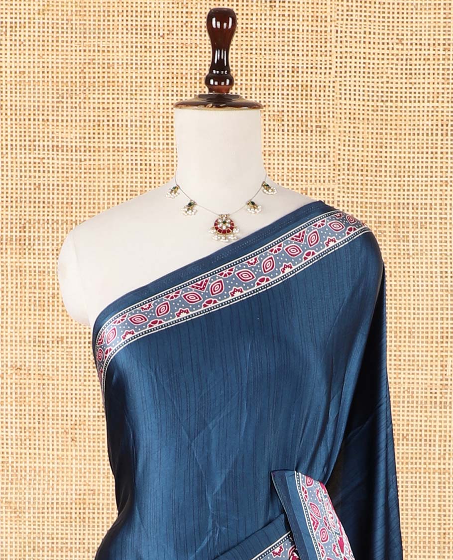Blue half-&-half style modal satin saree features floral & geometric design ajrakh printed contrast border & pallu
