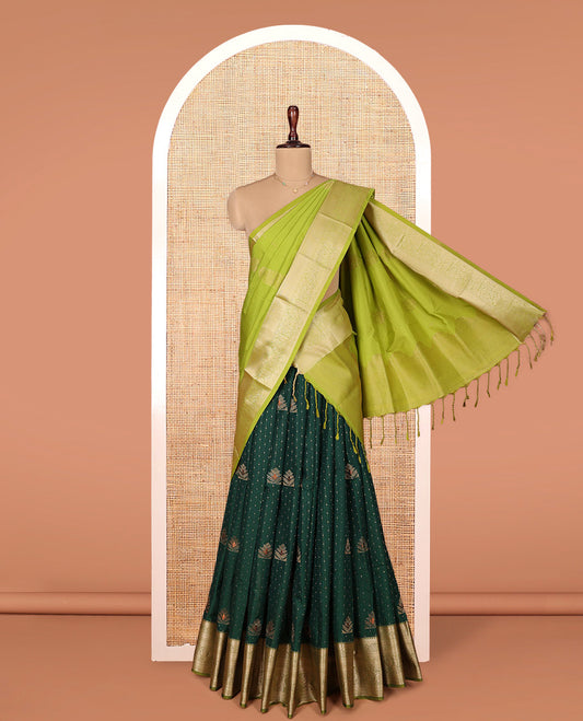 Green Art Silk Material Half Saree Set, Delicately Woven with Zari Buttas on Its Skirt, Complemented by a Contrast Traditional Zari Design Border, Paired with a Contrast Blouse, and Intricately Designed Dhavani