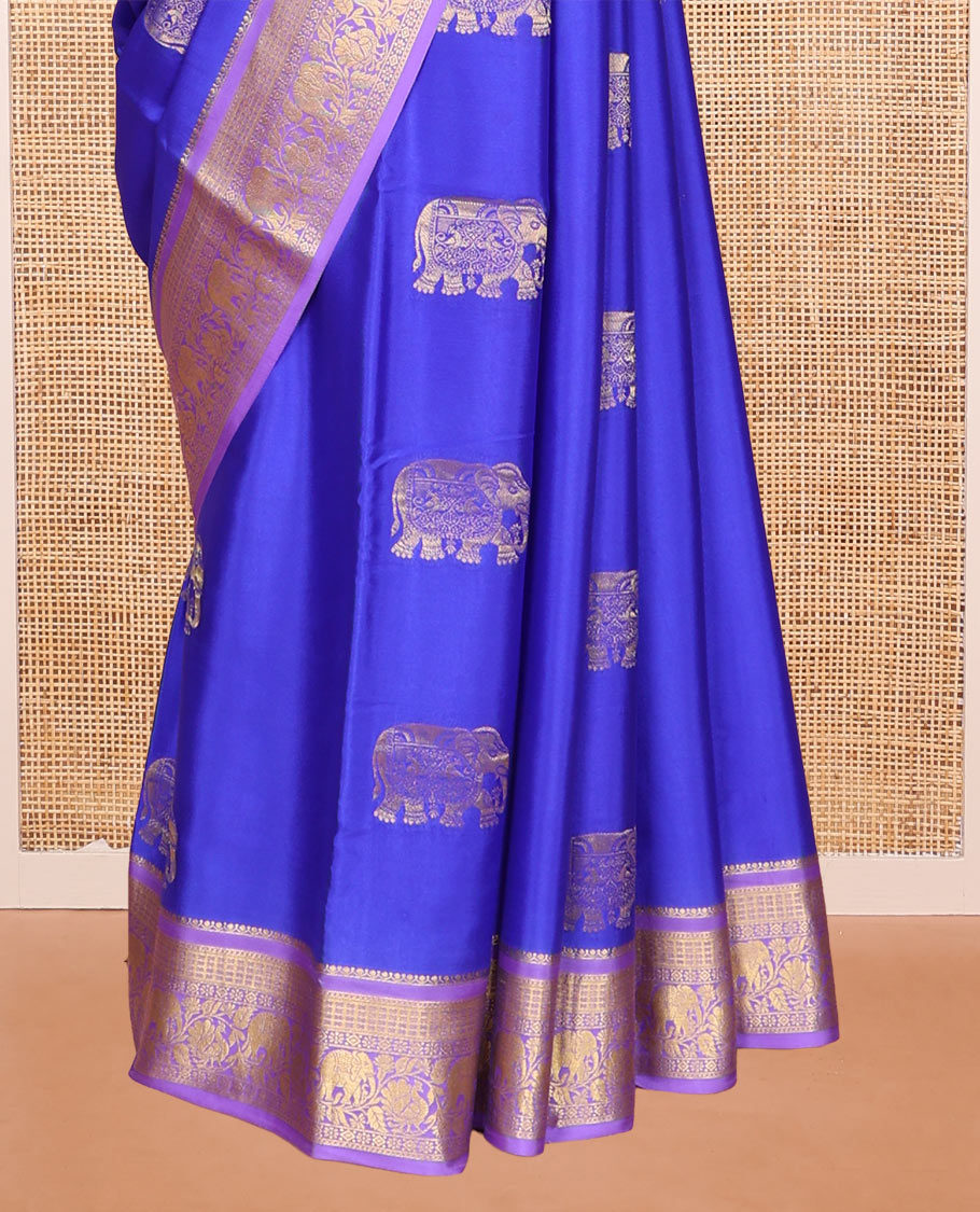 Blue Mysore Silk Saree, Mesmerized with Elephant Buttas Across Its Body, Complemented by Contrast Traditional Zari Border of Peacock-Elephant Designs, Intricately Designed Pallu, and Paired with a Contrast Blouse