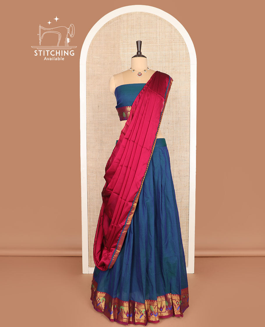 Blue cotton half-saree, plain with contrast paithani bordered skirt, matching blouse, and a contrast zari border dhavani