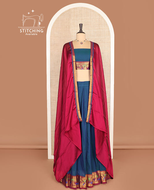 Blue cotton half-saree, plain with contrast paithani bordered skirt, matching blouse, and a contrast zari border dhavani