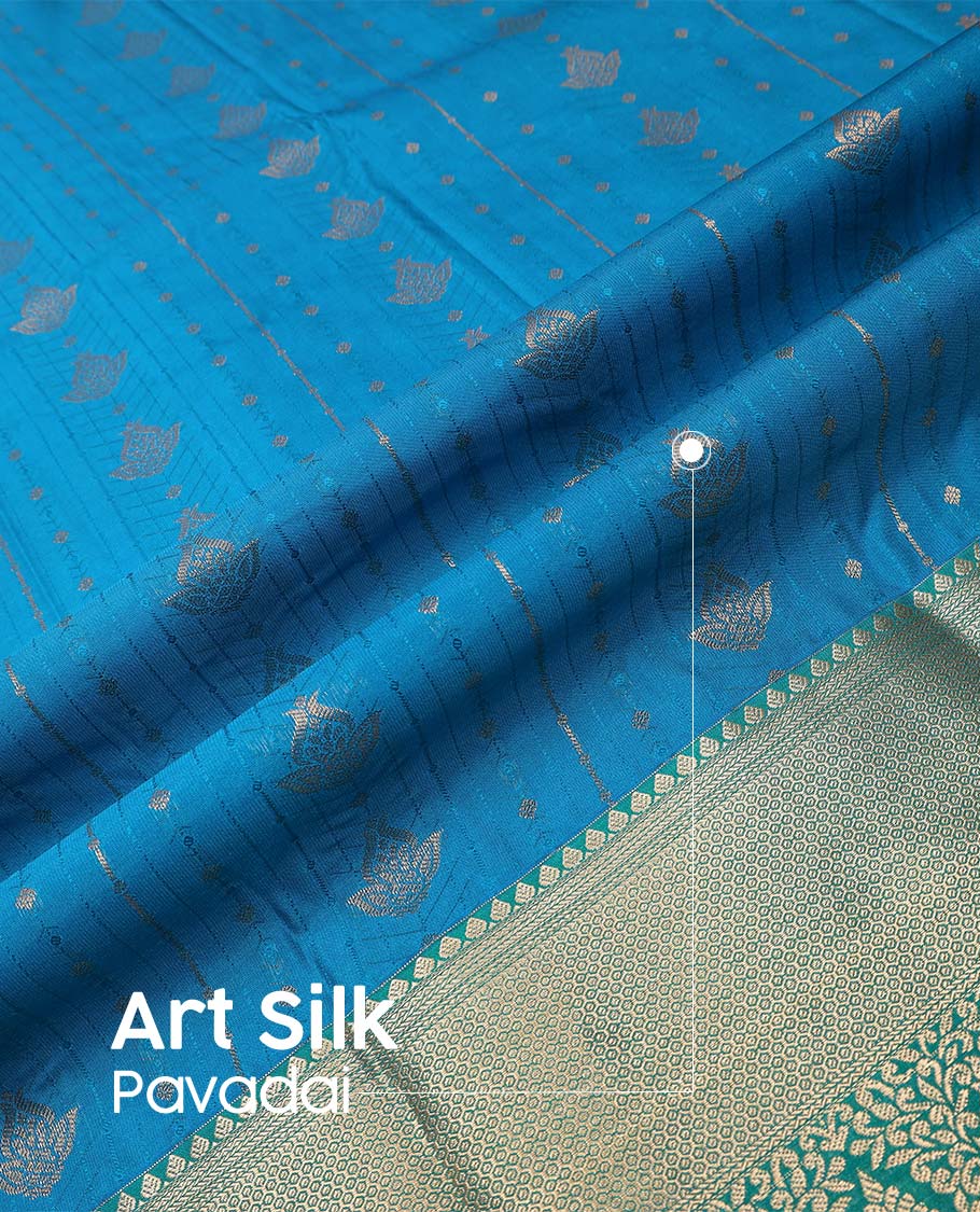 Blue art silk pavadai material, zari buttas with contrast traditional zari bordered skirt, and a contrast bordered blouse