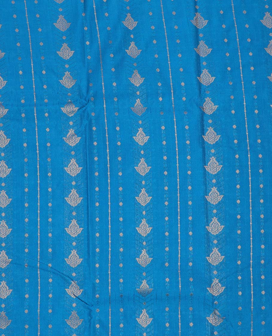 Blue art silk pavadai material, zari buttas with contrast traditional zari bordered skirt, and a contrast bordered blouse