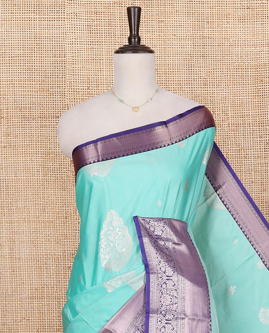 Blue Budget Silk Saree, Elegantly Highlighted with Zari Buttas on Its Body, Complemented by a Contrast Traditional Zari Border of Floral Creeper Designs, Grand Intricately Designed Pallu, and Paired with a Contrast Blouse