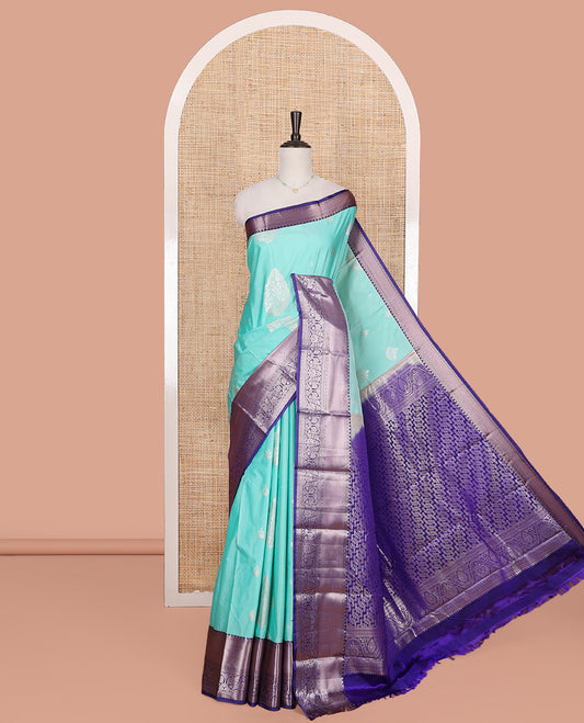 Blue Budget Silk Saree, Elegantly Highlighted with Zari Buttas on Its Body, Complemented by a Contrast Traditional Zari Border of Floral Creeper Designs, Grand Intricately Designed Pallu, and Paired with a Contrast Blouse