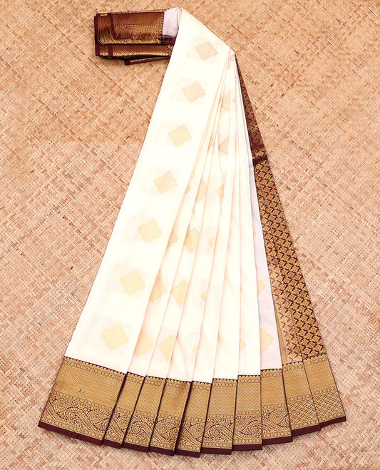 White Budget Silk Saree, Spotlighted with Zari Buttas on Its Body, Complemented by a Contrast Traditional Zari Design Border, Grand Pallu, and Paired with a Contrast Blouse