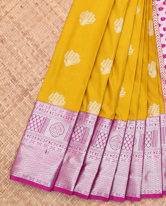 Mustard Budget Silk Saree, Graced with Buttas All Over Its Body, Complemented by a Contrast Traditional Zari Design Rettai Pettu Border, Pallu Steeped with Floral Designs, and Paired with a Contrast Blouse