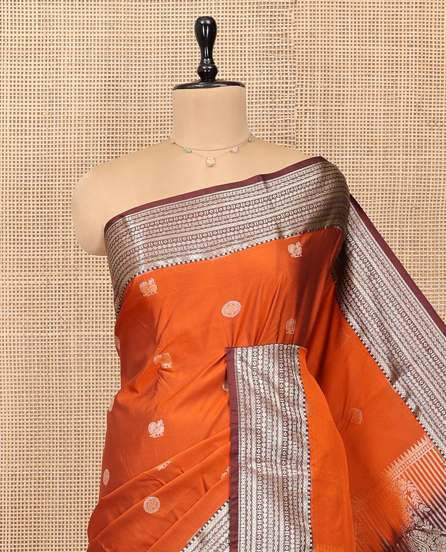Orange Budget Silk Saree, Artfully Detailed with Mayil-Chakram Buttas, Complemented by a Contrast Traditional Zari Border, Pallu of Jaal and Paisleys, and Contrast Blouse
