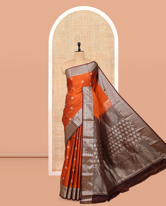 Orange Budget Silk Saree, Artfully Detailed with Mayil-Chakram Buttas, Complemented by a Contrast Traditional Zari Border, Pallu of Jaal and Paisleys, and Contrast Blouse