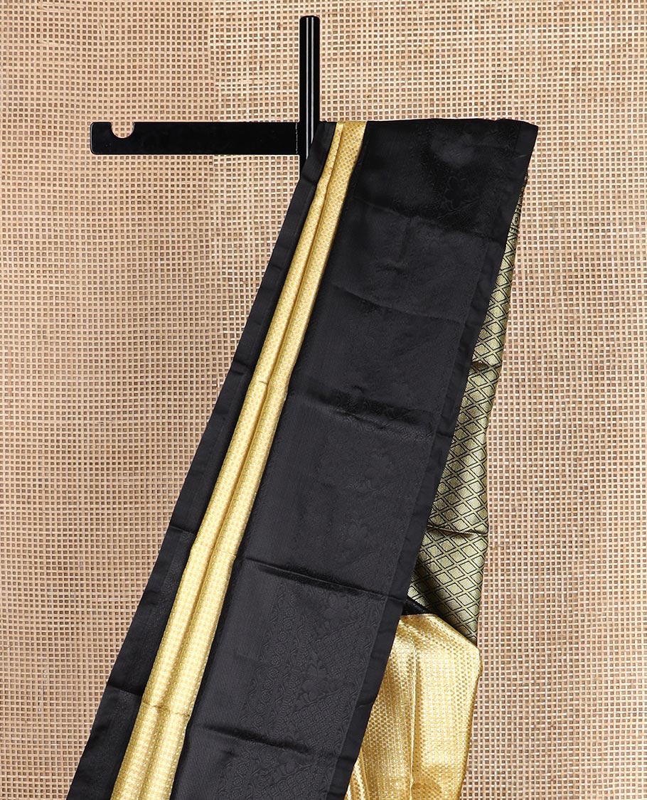 Yellow micro checked style woven budget silk saree, contrast black thread woven border of traditional motifs, and jaal pallu