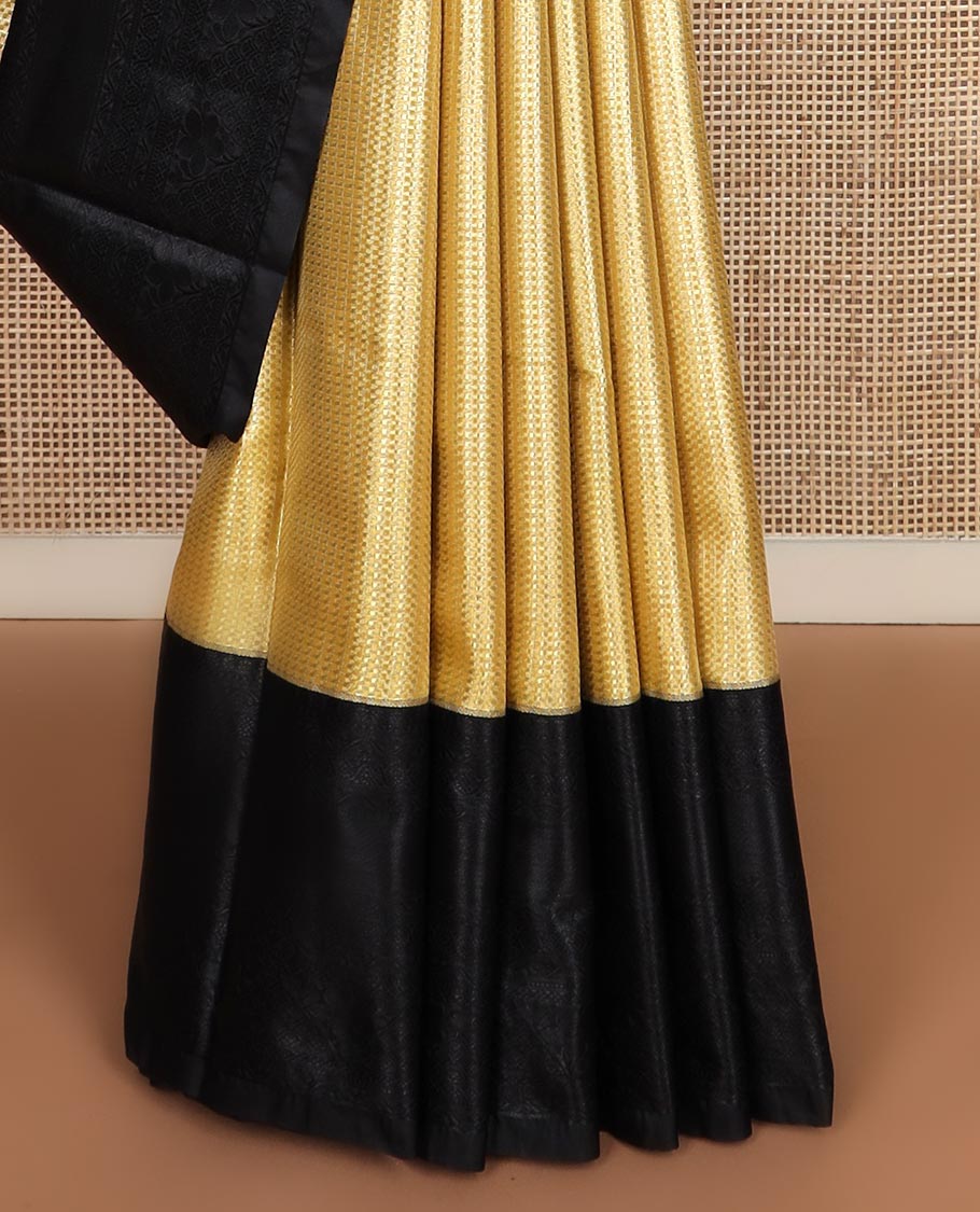 Yellow micro checked style woven budget silk saree, contrast black thread woven border of traditional motifs, and jaal pallu