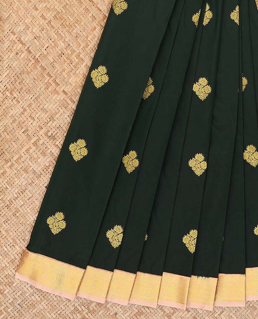 Deep green zari buttas gift saree, contrast peacock zari border, and pallu of geometric patterns