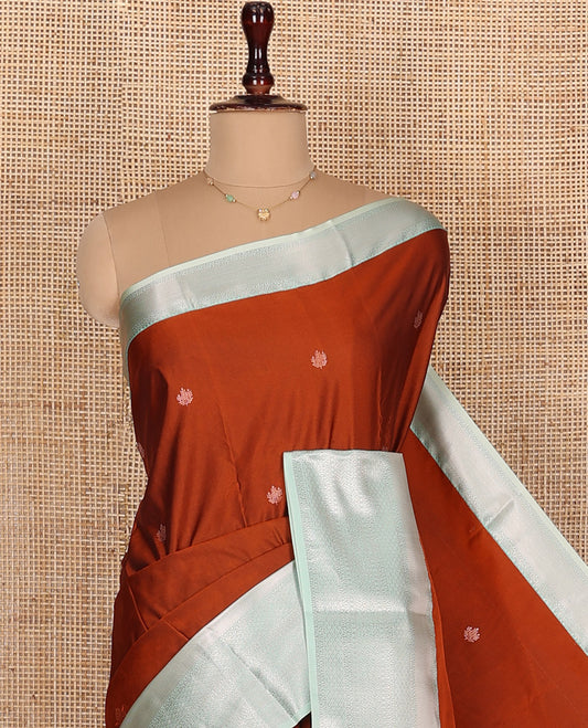 Orange Budget Silk Saree, Gleamed Up with Zari Buttas All Over Its Body, Complemented by a Contrast Traditional Zari Designs Woven Border, Elegantly Highlighted Pallu, and Paired with a Contrast Blouse