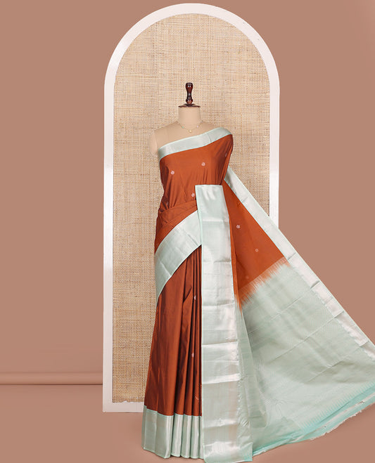 Orange Budget Silk Saree, Gleamed Up with Zari Buttas All Over Its Body, Complemented by a Contrast Traditional Zari Designs Woven Border, Elegantly Highlighted Pallu, and Paired with a Contrast Blouse