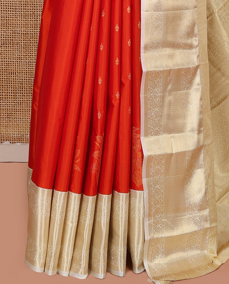 Rust Orange Budget Silk Saree, Gleamed Up with Zari Buttas on Its Body, Complemented by a Contrast Traditional Zari Design Border, Grandly Decked Up Pallu, and Paired with a Contrast Blouse