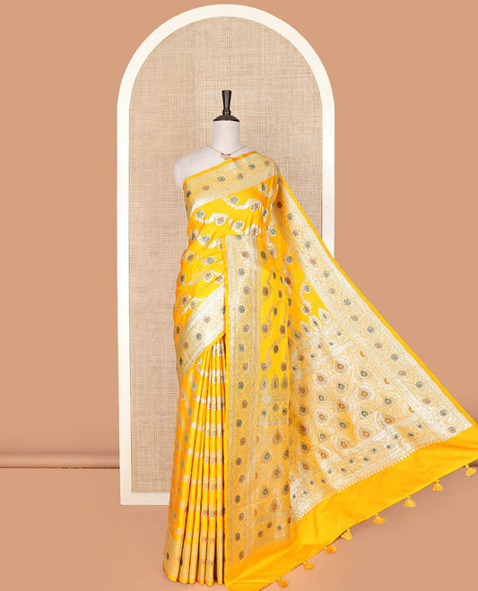 Yellow meenakari floral creeper design with stone work banarasi silk saree, floral creeper design stone work border, and pallu of intricate designs