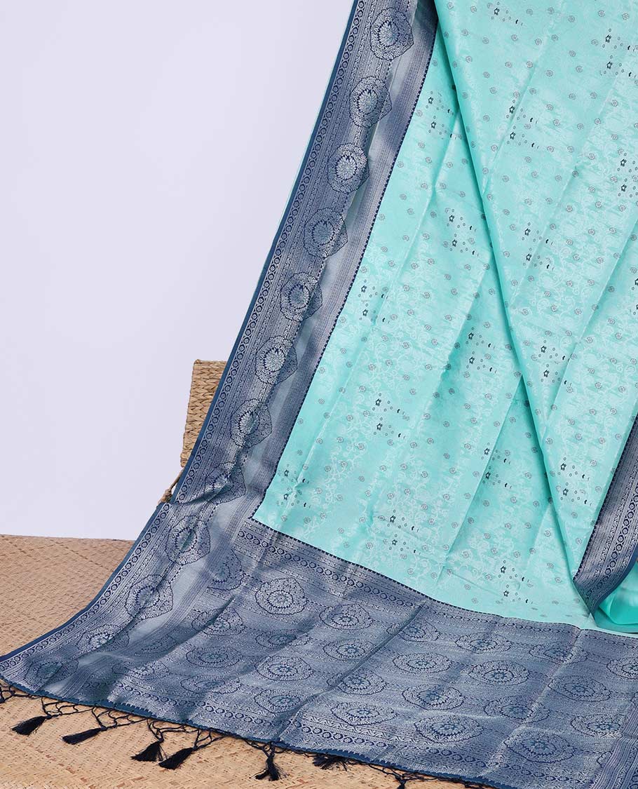 Green floral butter silk saree with contrast floral design border & pallu of floral jaal design