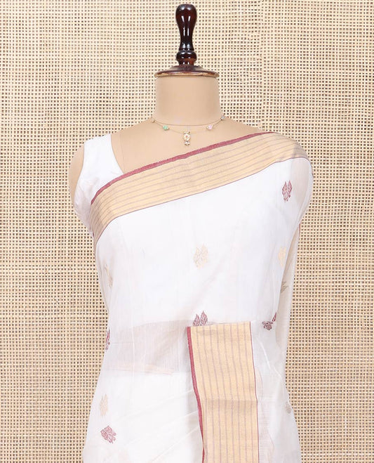 White Chanderi Cotton Saree, Delicately Woven with Leaf Buttas All Over Its Body, Highlighted by a Zari Striped Border, Pallu Steeped with Buttas, and Paired with a Matching Blouse