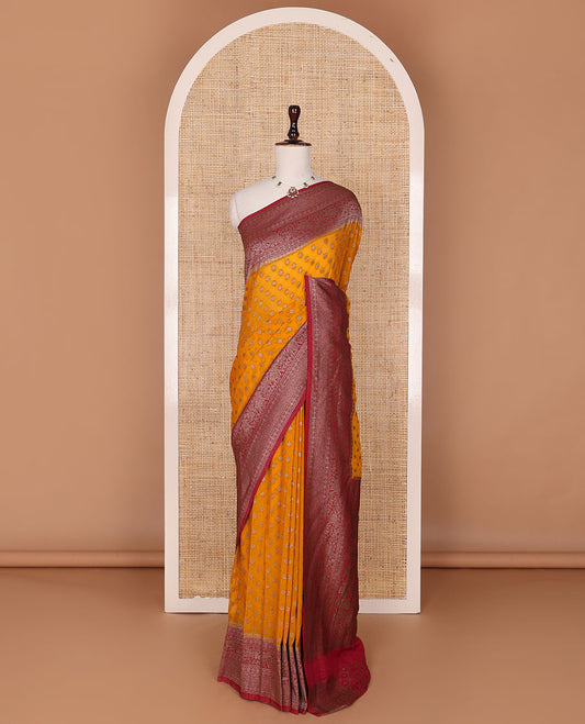 Orange zari buttas fancy crepe saree, contrast traditional zari border & animal motifs woven pallu