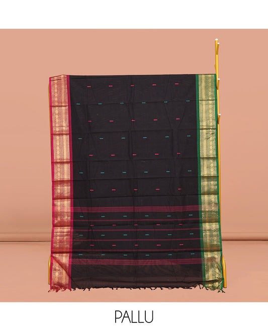 Black Chettinad Cotton Saree, Delicately Woven with Buttas All Over Its Body, Complemented by Contrast Traditional Zari Design Ganga-Jamuna Border, Pallu of Stripes, and Paired with a Matching Blouse