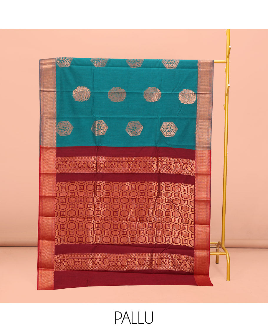 Rama Blue Semi-Silk Cotton Saree, Spotlighted with Zari Buttas All Over Its Body, Highlighted by a Traditional Zari Border, Pallu of Paisley Designs, and Paired with a Matching Blouse