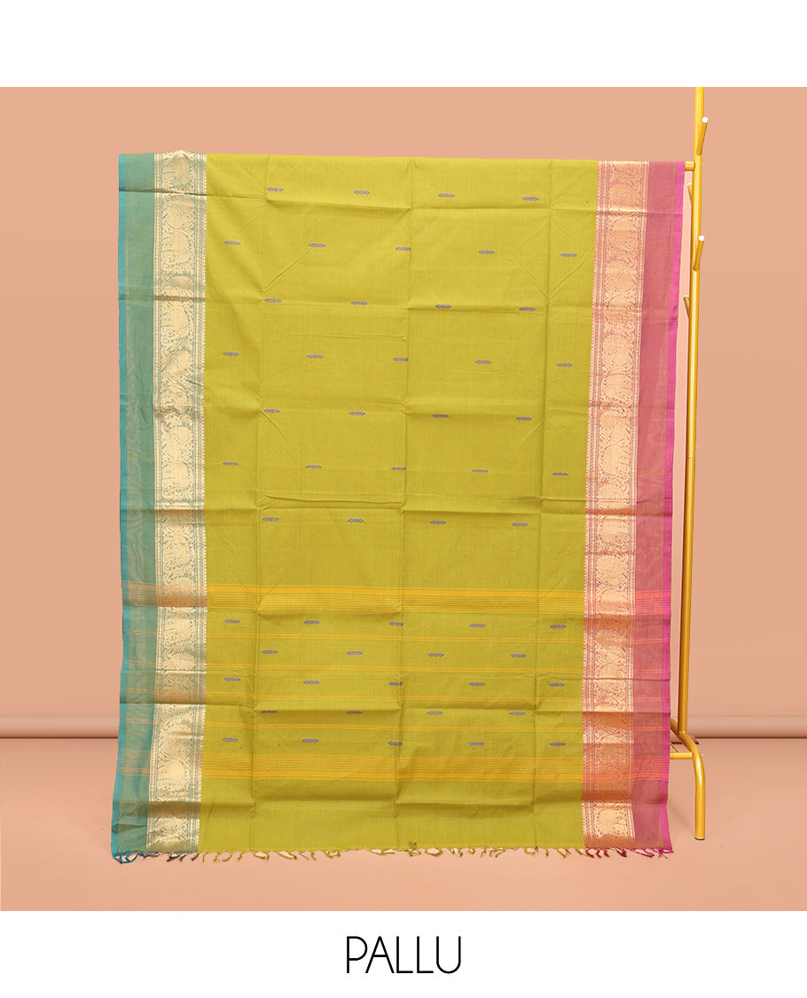 Parrot Green Chettinad Cotton Saree, Woven with Buttas All Over Its Body, Complemented by a Contrast Ganga-Jamuna Kal Eragina Border of Kodi Peacock and Elephant Designs, Pallu of Buttas and Stripes, and Paired with a Matching Blouse